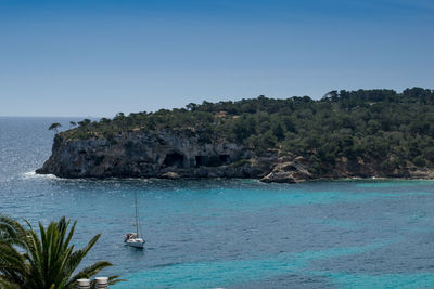 Scenic view of sea against clear blue sky