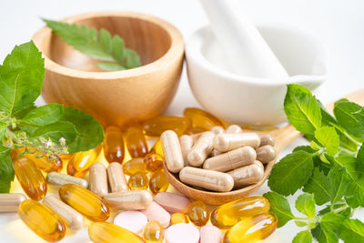 Close-up of pills in mortar and pestle