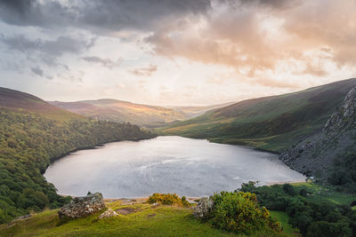 Dramatic sunset at lough tay, called the guinness lake located in wicklow mountains