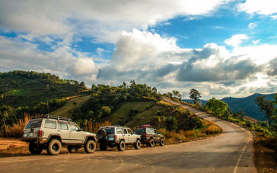 Sport utility vehicles on mountain road