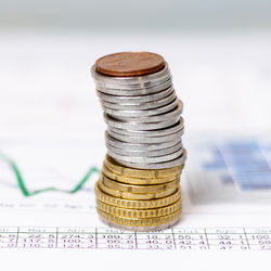 Close-up of coins on table