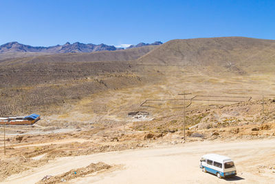 Car moving on road in desert