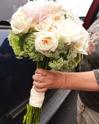 Close-up of hand holding bouquet