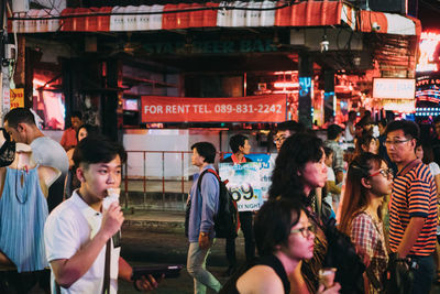 People on street at night