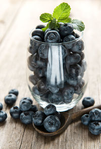 Freshly picked blueberries on a wooden background. concept for healthy eating