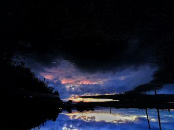 Panoramic view of trees against sky at night