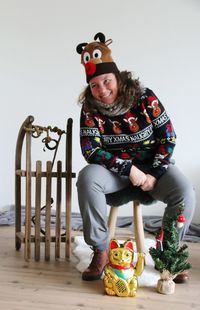 Portrait of happy boy sitting on chair
