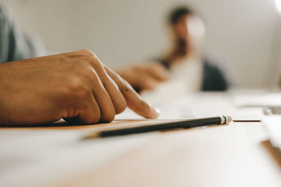 Midsection of woman working on table