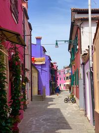 Narrow alley amidst buildings in city