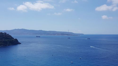 Scenic view of sea against blue sky