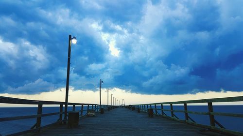 Pier over sea against sky