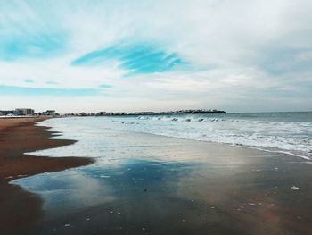 Scenic view of beach against sky