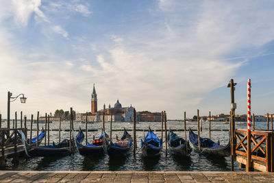 Gondolas with san giorgio maggiore island in the background, venice, italy