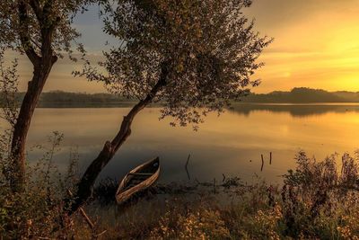 Scenic view of lake at sunset