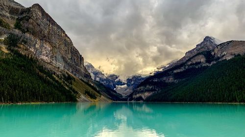 Scenic view of lake and mountains against sky