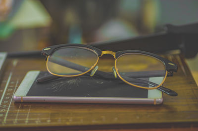 Close-up of sunglasses on table