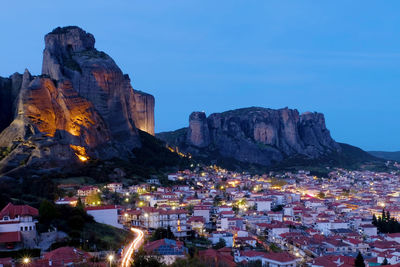 View of illuminated buildings in city at night