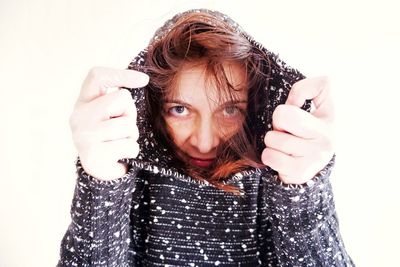 Portrait of a beautiful young woman over white background