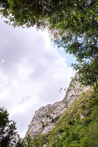 Low angle view of rocks against sky