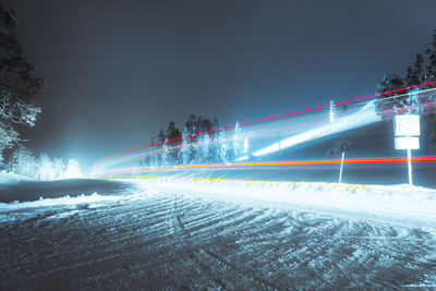 Light trails on road in winter at night