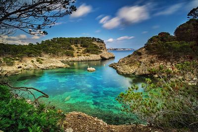 Scenic view of sea against blue sky