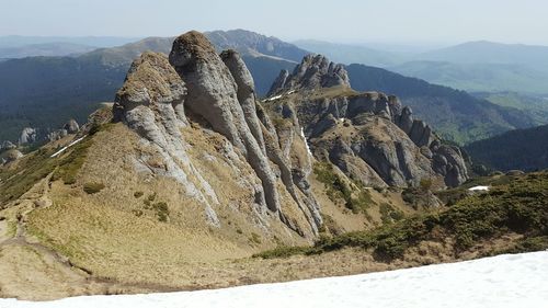 Panoramic view of rock formations against sky