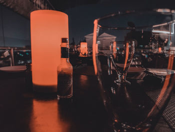 Glass of wine bottles on table in restaurant