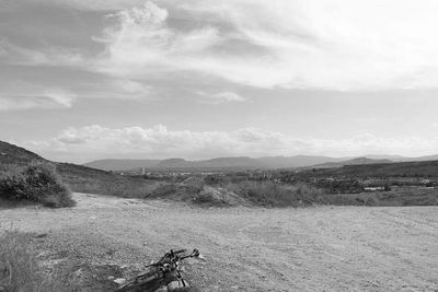 Scenic view of landscape against cloudy sky