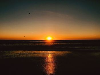 Scenic view of sea during sunset