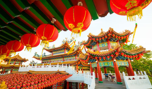 Low angle view of lanterns hanging outside building