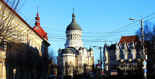 Low angle view of buildings against sky in city