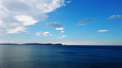 Scenic view of sea against cloudy sky