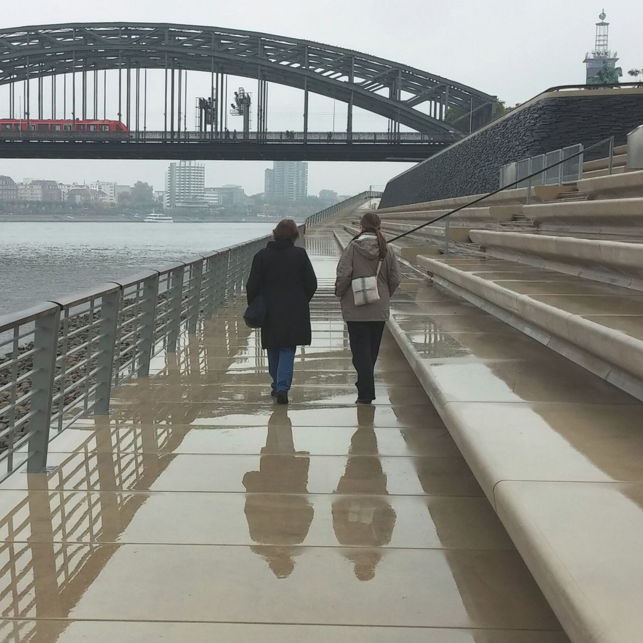 connection, bridge - man made structure, architecture, built structure, transportation, travel destinations, travel, rear view, shadow, walking, full length, city, water, engineering, tourism, bridge, river, day, city life, outdoors, sydney harbor bridge, famous place, long