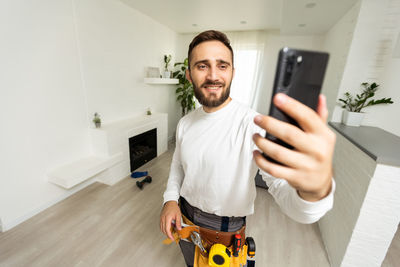 Portrait of young man using mobile phone