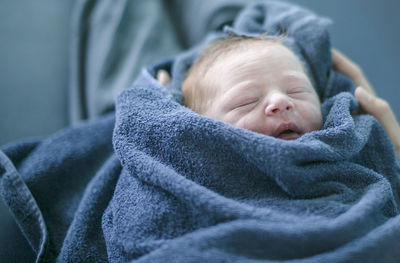 Newborn baby wrapped in towel, danderyd, stockholm, sweden