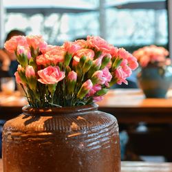 Close-up of flower vase on table