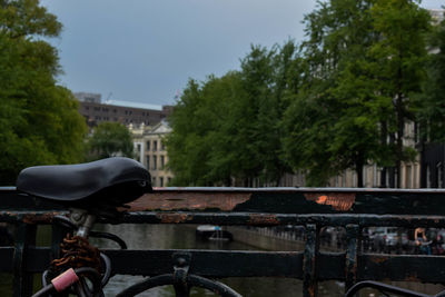 Bicycle by canal in city