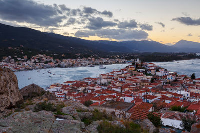 High angle view of townscape and mountains against sky