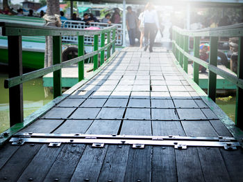 Man walking on footpath in city