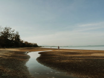 Scenic view of beach against clear sky