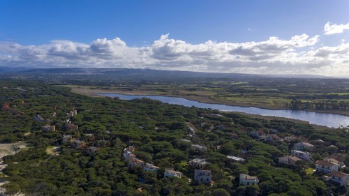 Scenic view of landscape and buildings against sky