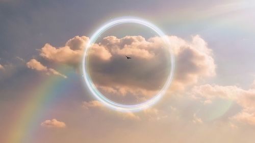 Digital composite image of bubbles against sky