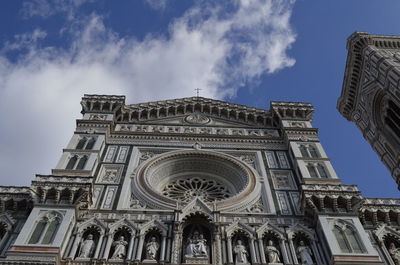 Low angle view of cathedral against cloudy sky