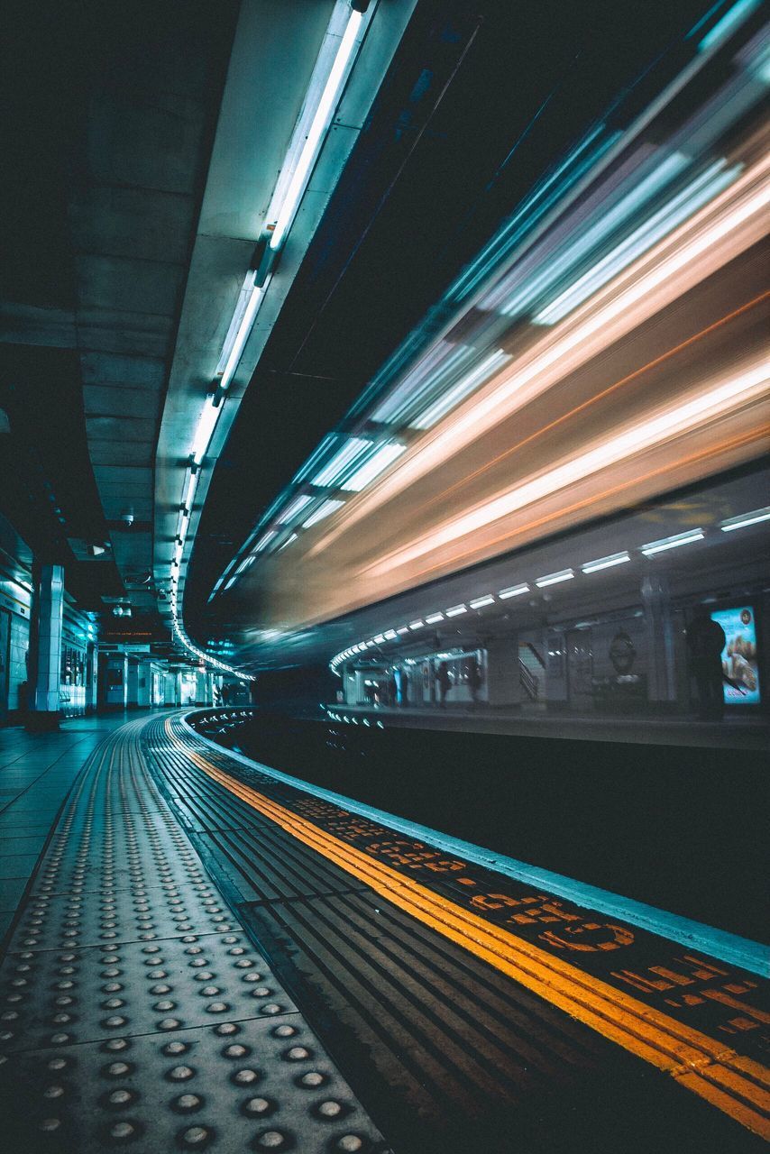 BLURRED MOTION OF TRAIN AT RAILROAD STATION