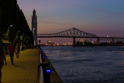 View of bridge over river in city