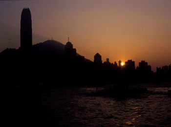 Silhouette buildings at sunset