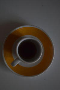 Directly above shot of coffee cup on table