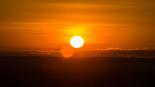 Scenic view of silhouette landscape against romantic sky at sunset