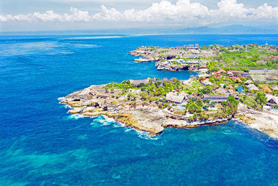 High angle view of sea and buildings against sky