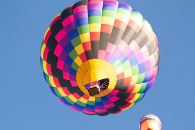 Low angle view of hot air balloon against blue sky